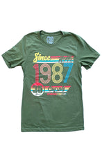 Load image into Gallery viewer, Cooyah Jamaica retro style women&#39;s green graphic tee with colorful 1987 design on the front.
