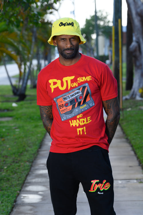 Cooyah Jamaica. Put on Some 90s Dancehall and Handle it! Men's crew neck t-shirt in red with a retro cassette tape design. We are a Jamaican owned clothing brand established in 1987.