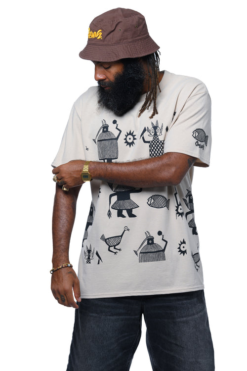 Person wearing a beige Cooyah t-shirt with black African hand-drawn graphics and a brown bucket hat on a white background