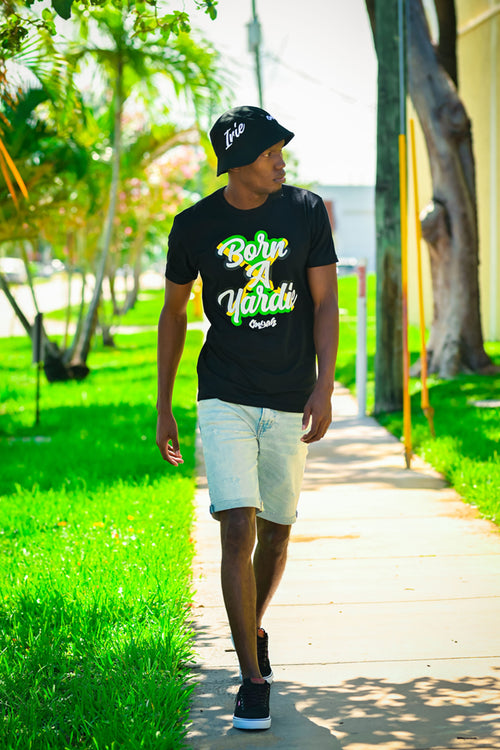 Cooyah Jamaica. Born A Yardie graphic tee. Men's short sleeve, 100% ringpun cotton. Jamaican streetwear clothing brand. 876, IRIE Bucket hats