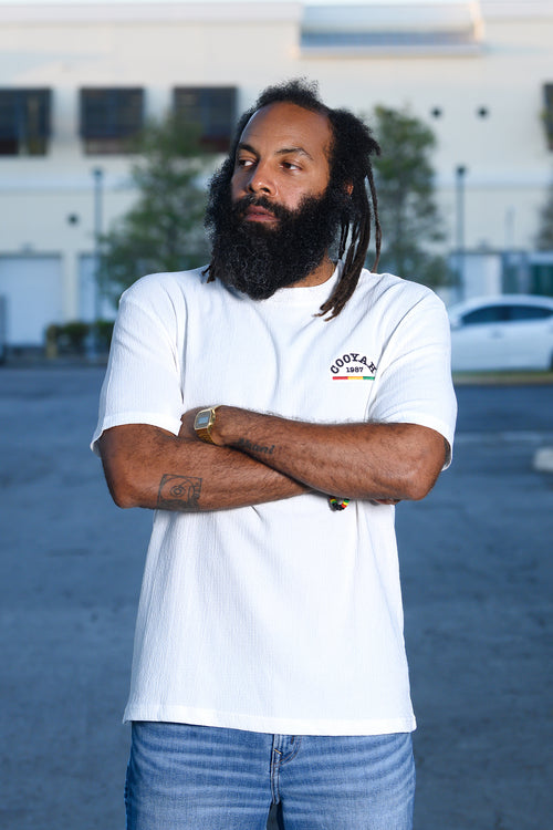 Cooyah Clothing - Men's white cotton gauze fabric shirt with "Cooyah" 1987 embroidered in red, gold, and green on the front. Short sleeve, crew neck shirt.