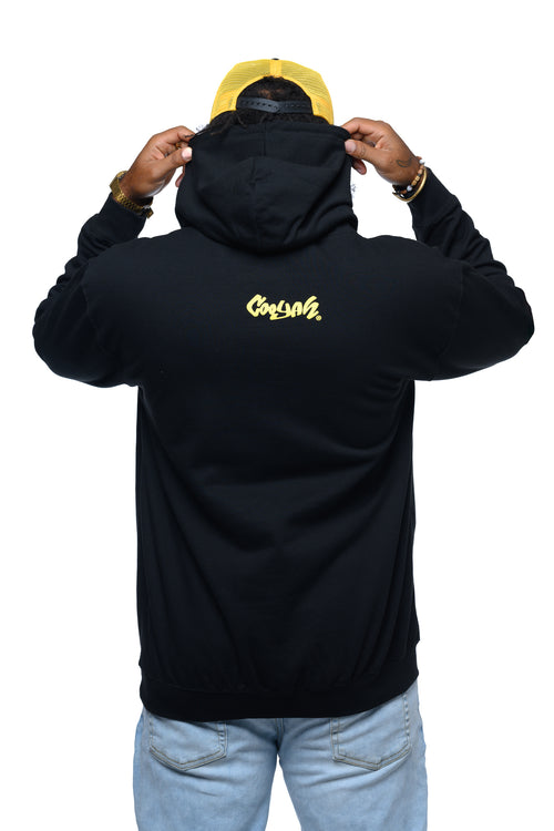 Man wearing a black hoodie with yellow Cooyah logo on the back, standing against a white background