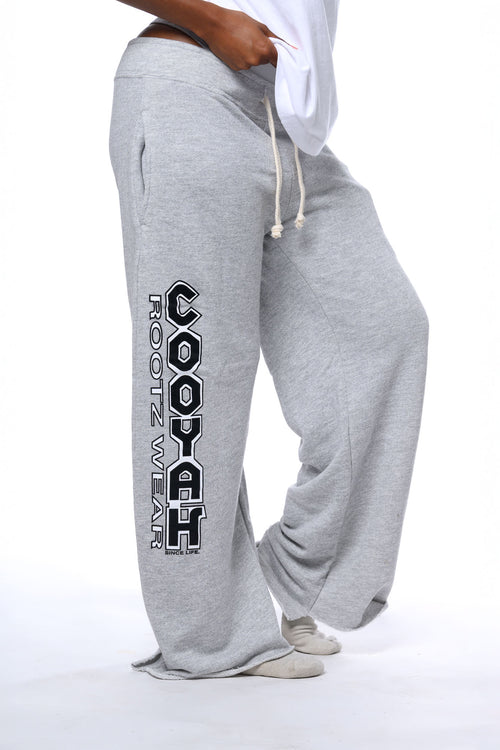 Cooyah Rootswear - Womens relaxed fit lounge pants.  Casual streetwear look with screen printed graphics on the side, wide leg, drawstring, side pockets, and raw vintage hem.