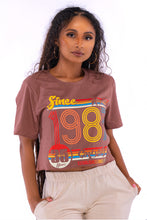 Load image into Gallery viewer, Cooyah retro style women&#39;s brown graphic tee with colorful 1987 design on the front.
