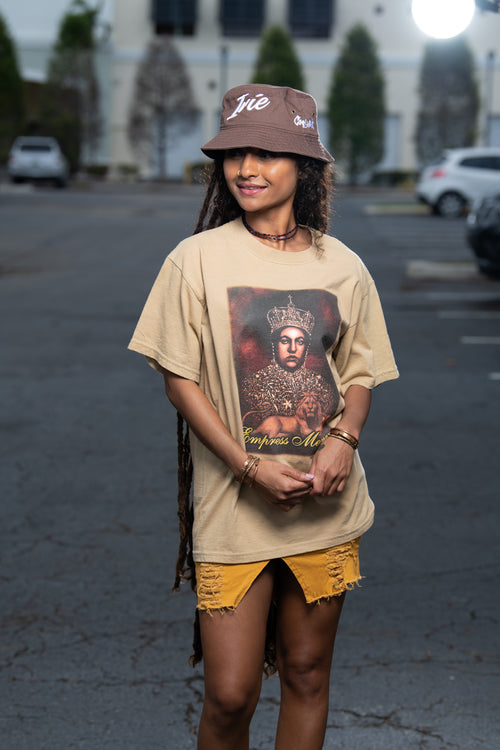 Cooyah Jamaica. Empress Menen short sleeve graphic tee on a brown shirt. Rasta Rootswear clothing. Rastafari IRIE