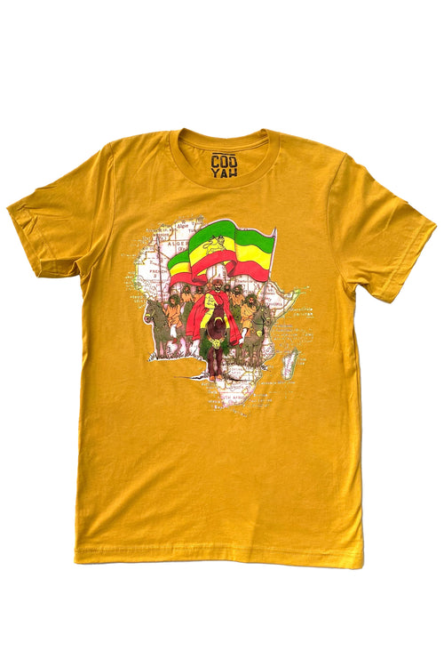 Cooyah Haile Selassie i Rastafari graphic tee in gold.  As a Jamaican owned clothing brand since 1987, we take pride in bringing you this classic piece.
