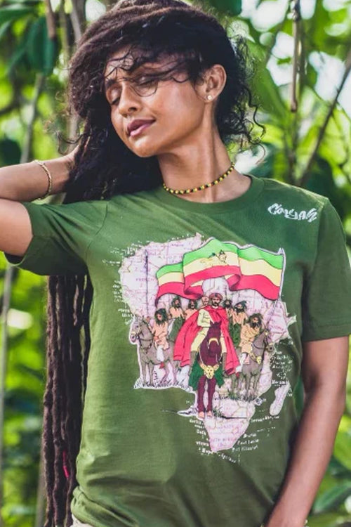 Cooyah Clothing Brand. Women's  Haile Selassie with Ethiopian Flag rasta graphic tee.  Screen printed on ringspun cotton.  As a Jamaican owned clothing brand since 1987, we take pride in bringing you this classic piece. Don't wait, get yours now!