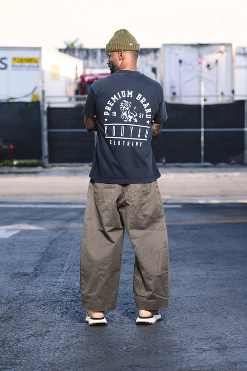 Cooyah Jamaican streetwear clothing - Men's navy blue boxy fit Premium Brand Graphic Tee with Lion print.