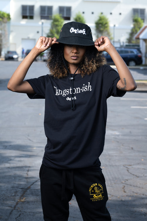 Cooyah Clothing. Kingstonish graphic tee. Women's black t-shirt. Kingston, Jamaica.  As a Jamaican owned clothing brand since 1987, we take pride in bringing you this classic piece.