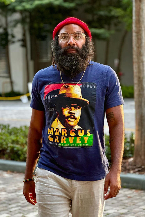 Cooyah Jamaica - Men's Marcus Garvey graphic tee in navy.  Screen printed at Cooyah Studio on soft, 100% ringspun cotton.   As a Jamaican owned clothing brand since 1987, we take pride in bringing you this classic shirt. Don't wait, get yours now!