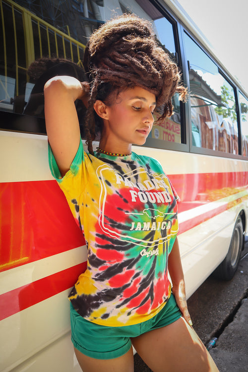 Cooyah Clothing. Women's RASTA Tie-Dye graphic tee with Paradise Found Jamaica Design. Ringspun cotton, short sleeve, crew neck. Jamaican reggae brand.