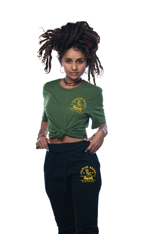 Cooyah Jamaica. Women's black joggers with gold Premium Brand Lion logo screen printed on the front. We are a Jamaican streetwear clothing brand since 1987. IRIE