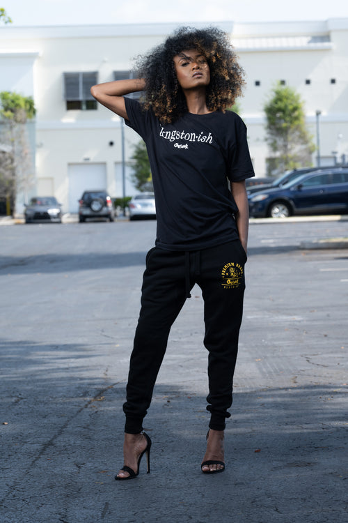 Cooyah Clothing. Kingstonish graphic tee. Women's black t-shirt. Kingston, Jamaica.  As a Jamaican owned clothing brand since 1987, we take pride in bringing you this classic piece.