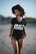Cooyah Jamaica - Women's Jah Know V-Neck graphic tee in black.  Screen printed at Cooyah Studio in Miami with reggae colors.  As a Jamaican owned clothing brand since 1987, we take pride in bringing you this classic piece.