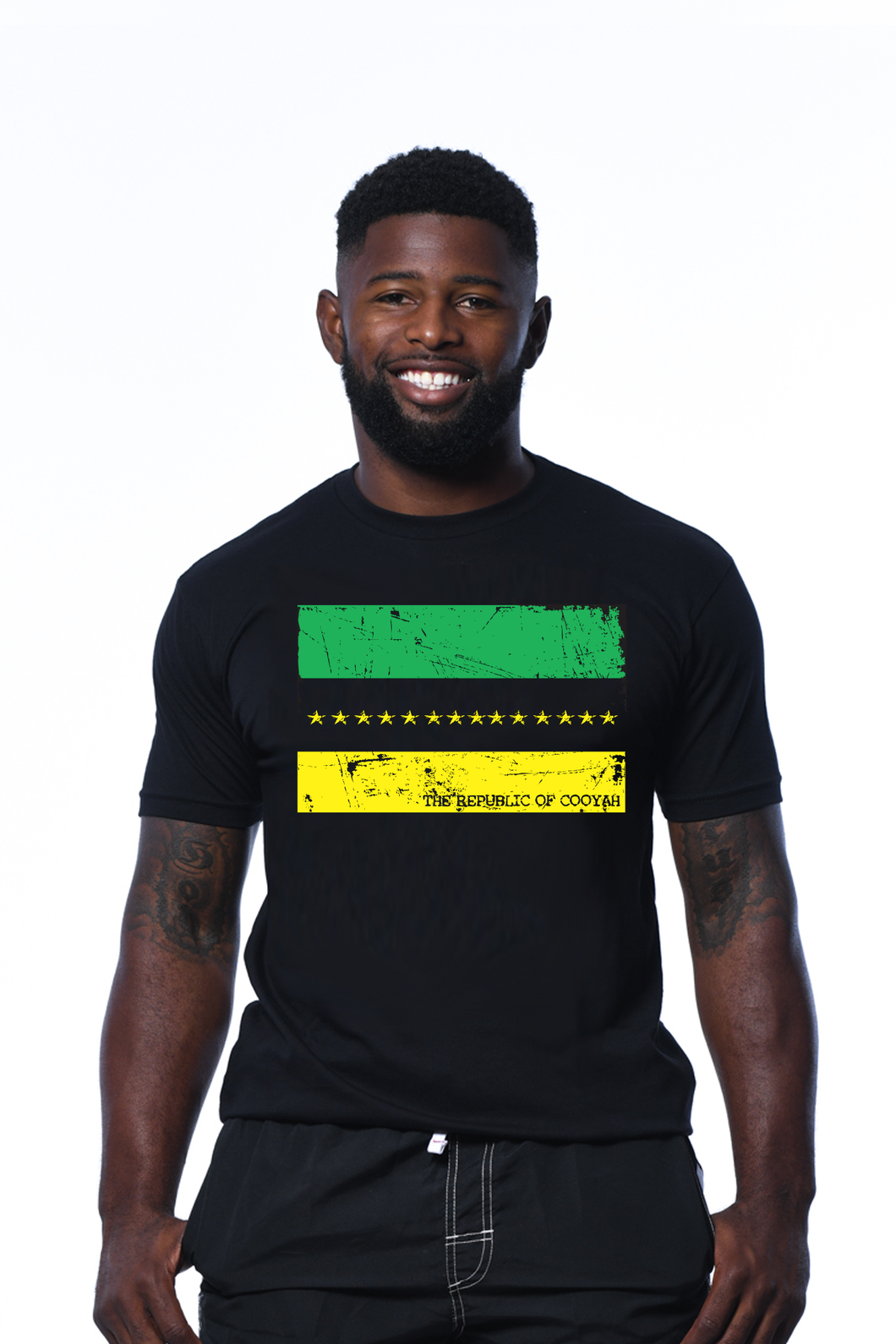 Cooyah Jamaica.  Men's 14 Star Republic tee.  Short sleeves, screen printed in Jamaican colors with a vintage style print.  Ringspun cotton.  Reggae clothing