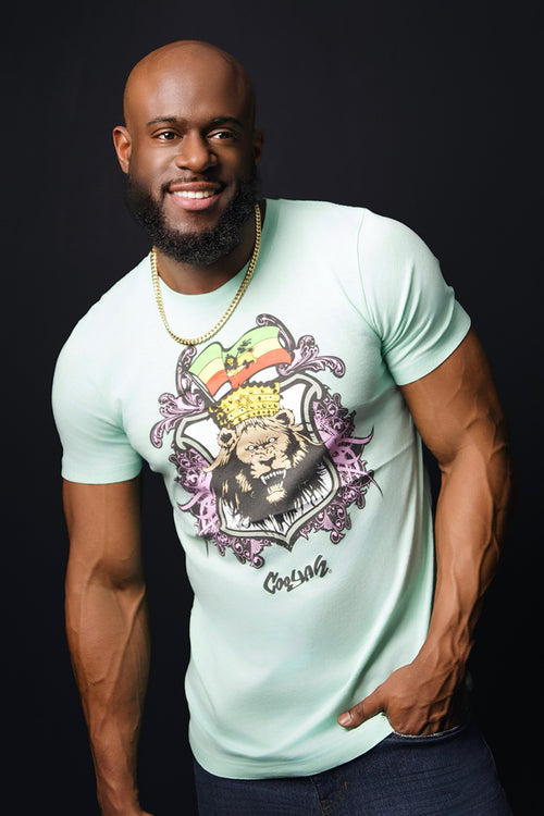 Cooyah Jamaica.  Men's mint green rasta lion graphic tee.  We are a Jamaican streetwear clothing brand established in 1987.