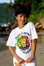 Cooyah Jamaica women's white t-shirt with a colorful rasta lion graphic and text 'Rasta By Nature, Rebel By Choice.'