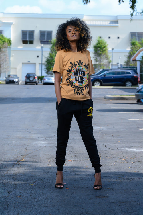 Cooyah Jamaica. Smoke Weed Live Longer Tee. Cannabis, Kush screen printed graphic tee in olive green. Women's short sleeve ringspun cotton t-shirt. Jamaican clothing brand.