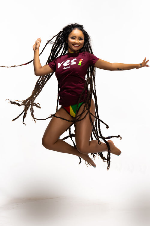 Cooyah Jamaica women's burgundy t-shirt with Yes I graphic screen printed in reggae colors. Jamaican clothing brand