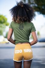 Load image into Gallery viewer, Cooyah Jamaica. Women&#39;s Tennis Shorts. Athleisure style mustard yellow with white piping.
