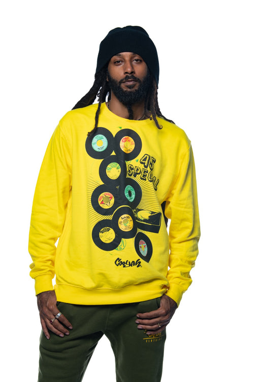 Cooyah Jamaica.  Men's pullover sweatshirt with vintage reggae and rocksteady 45 records graphics screen printed on the front.  Soft fleece fabric in yellow.  We are a Jamaican owned clothing brand established in 1987.
