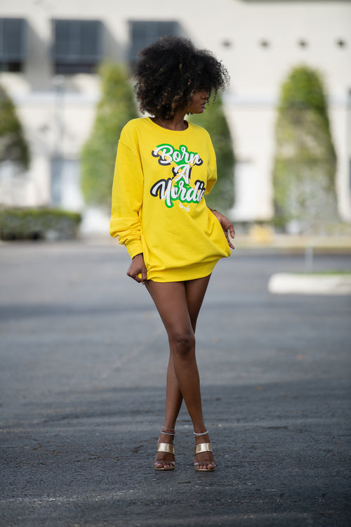 Cooyah women's yellow pullover sweatshirt with  Born A Yardie graphic screen printed in Jamaian colors