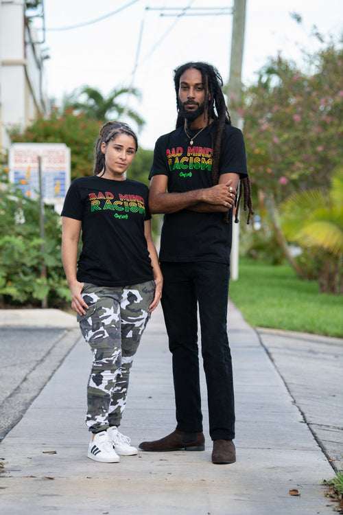 Cooyah Jamaica.  Men's and women's graphic tees with Bad Mind Racism graphics screen printed in rasta colors.  Jamaican owned reggae clothing brand since 1987.  One Love