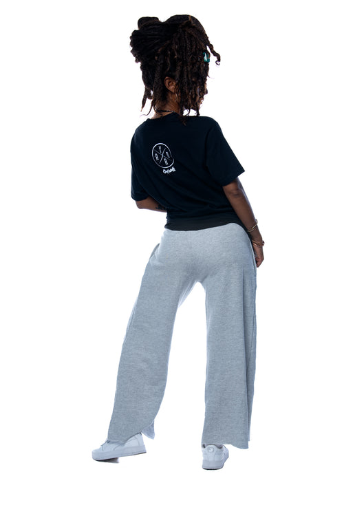 Cooyah Jamaica - Women's black Irie Yard graphic tee. Screen printed at Cooyah Studio on soft, ringspun cotton fabric. As a Jamaican owned clothing brand since 1987, we take pride in bringing you this classic piece.