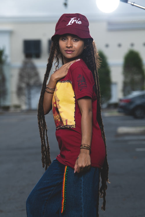 Cooyah Clothing. Haile Selassie Rastafari Lion graphic tee in burgundy. Crew neck, short sleeve, soft, ringspun cotton. As a Jamaican owned clothing brand since 1987, we take pride in bringing you this classic rasta shirt.