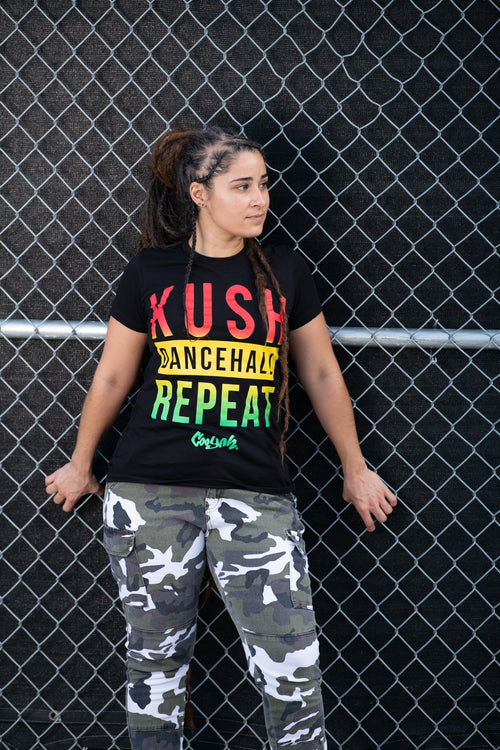 Cooyah Jamaica. Women's Kush, Dancehall graphic tee in black. Screen printed with rasta colors design. Jamaican Clothing Brand. IRIE