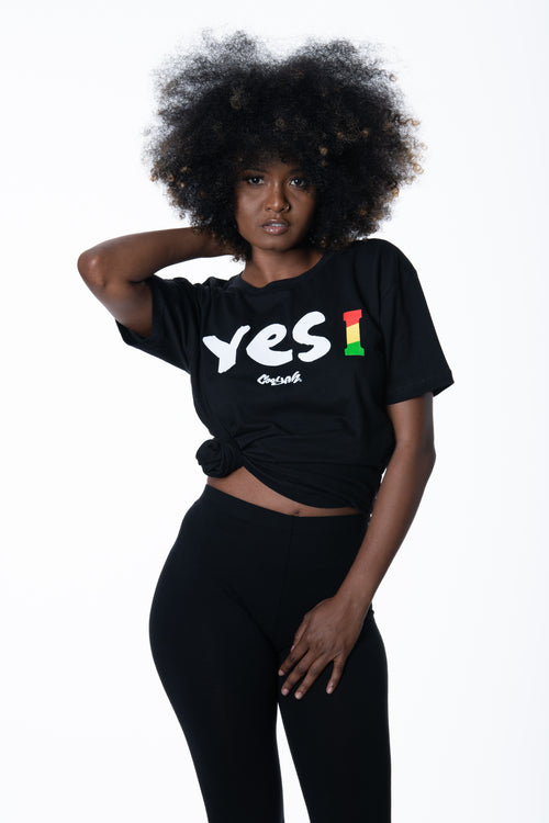 Cooyah Jamaica. Women's short sleeve tee with Yes I graphic. Black t-shirt screen printed in rasta colors. Reggae style. Jamaican clothing band. IRIE