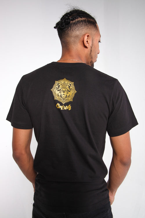 Cooyah - Men's Lion Mandala T-Shirt.  Black with gold screen print.
As a Jamaican owned clothing brand since 1987, we take pride in bringing you this classic shirt.