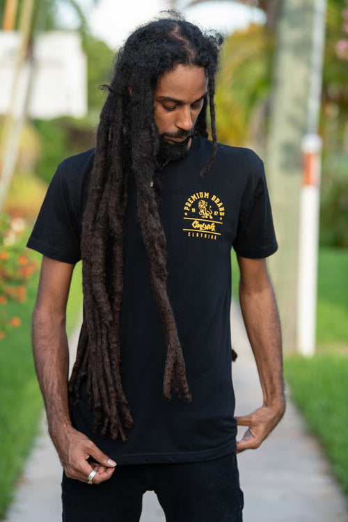 Cooyah Jamaica.  Men's Premium Brand graphic tee.  Gold Lion design screen printed on a black ringspun cotton t-shirt.  Jamaican streetwear clothing brand.