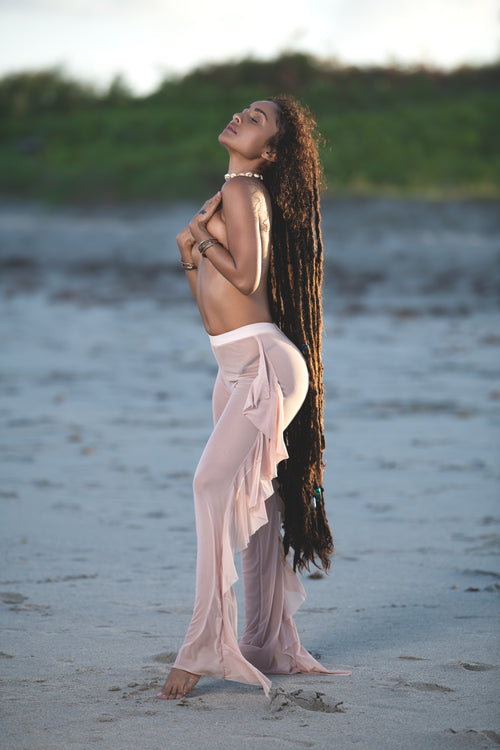 Cooyah Jamaica. Dancehall style beachwear. Micro Mesh Flutter Pants in nude. As a Jamaican owned clothing brand since 1987, we take pride in bringing you this classic piece. Don't wait, get yours now!