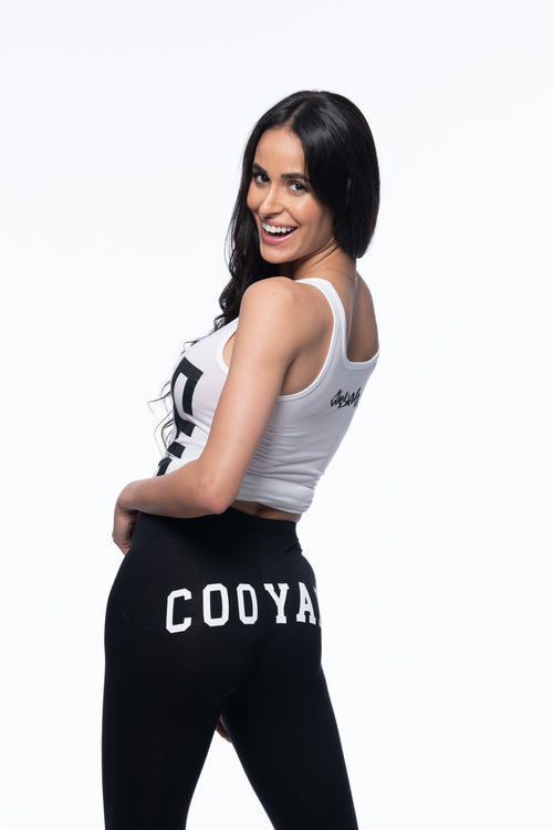 Cooyah Jamaica. Women's black dancehall leggings with white tank top. Jamaican reggae clothing brand.