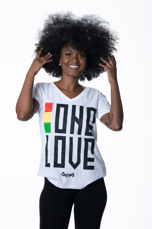Cooyah Jamaica. One Love women's graphic tee in white. V-Neck, short sleeve, ringspun cotton screen printed in reggae colors. Jamaican clothing brand.