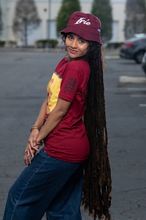 Cooyah Clothing. Haile Selassie Rastafari Lion graphic tee in burgundy. Crew neck, short sleeve, soft, ringspun cotton. As a Jamaican owned clothing brand since 1987, we take pride in bringing you this classic shirt.