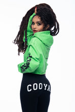 Load image into Gallery viewer, Cooyah Clothing.  Women&#39;s lime green cropped hoodie with irie graphic. Hand-printed Jamaican streetwear designs screen printed on the  back,  front, and sleeve  and styled with a pair Dancehall leggings.
