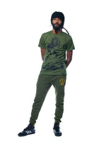 Load image into Gallery viewer, Cooyah Clothing. Men&#39;s Premium Brand Joggers in green with Lion graphic. Jamaican streetwear clothing brand.
