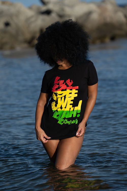Cooyah Jamaica. Women's black graphic tee with See We Yah Jamaican patois graphics in reggae colors. Short sleeve, crew neck, ringspun cotton.