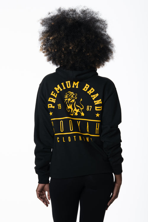 Cooyah Jamaica, Premium Brand hoodie with lion graphic in black and gold. We are a Jamaican rootswear clothing company since 1987.