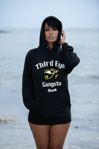Cooyah Jamaica. Women's black Third Eye Gangsta pullover hoodie.  Eye of Rah image on the front and back.  Jamaican clothing brand.