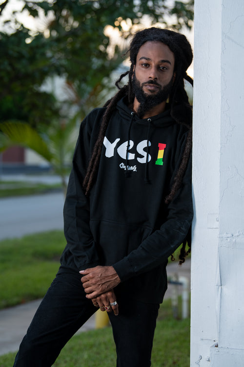 Cooyah Clothing. Men's Yes I Jamaica hoodie in black. Screen printed design in reggae colors. Jamaican streetwear clothing. IRIE