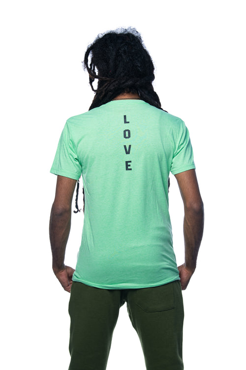 Men's green t-shirt with love graphic.  As a Jamaican owned clothing brand since 1987, we take pride in bringing you this classic piece.