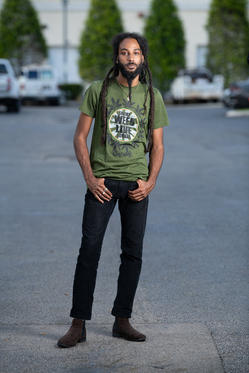 Cooyah Jamaica. Smoke Weed Live Longer Tee. Cannabis, Kush screen printed graphic tee in olive green. Men's short sleeve ringspun cotton t-shirt. Jamaican clothing brand.
