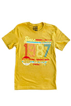 Load image into Gallery viewer, Cooyah Jamaica retro style women&#39;s mustard yellow graphic tee with colorful 1987 design on the front.
