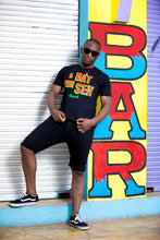 Load image into Gallery viewer, Cooyah Jamaica. A Dat Yuh Seh Men&#39;s Jamaican patois graphic tee. Screen printed in reggae colors. Caribbean menswear since 1987. IRIE

