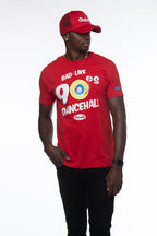 Person wearing a red t-shirt and cap with text and graphics on a white background
