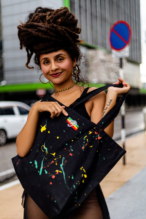 Caribbean Built Tote Bag with hand-painted reggae colors on both sides.  Cooyah label stitched on the back.