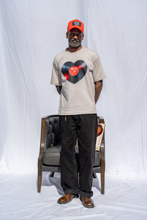 Cooyah men's heart shaped vinyl graphic tee printed on a boxy style sand colored shirt.  